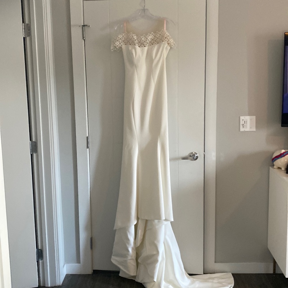 Brand new wedding dress never worn.
